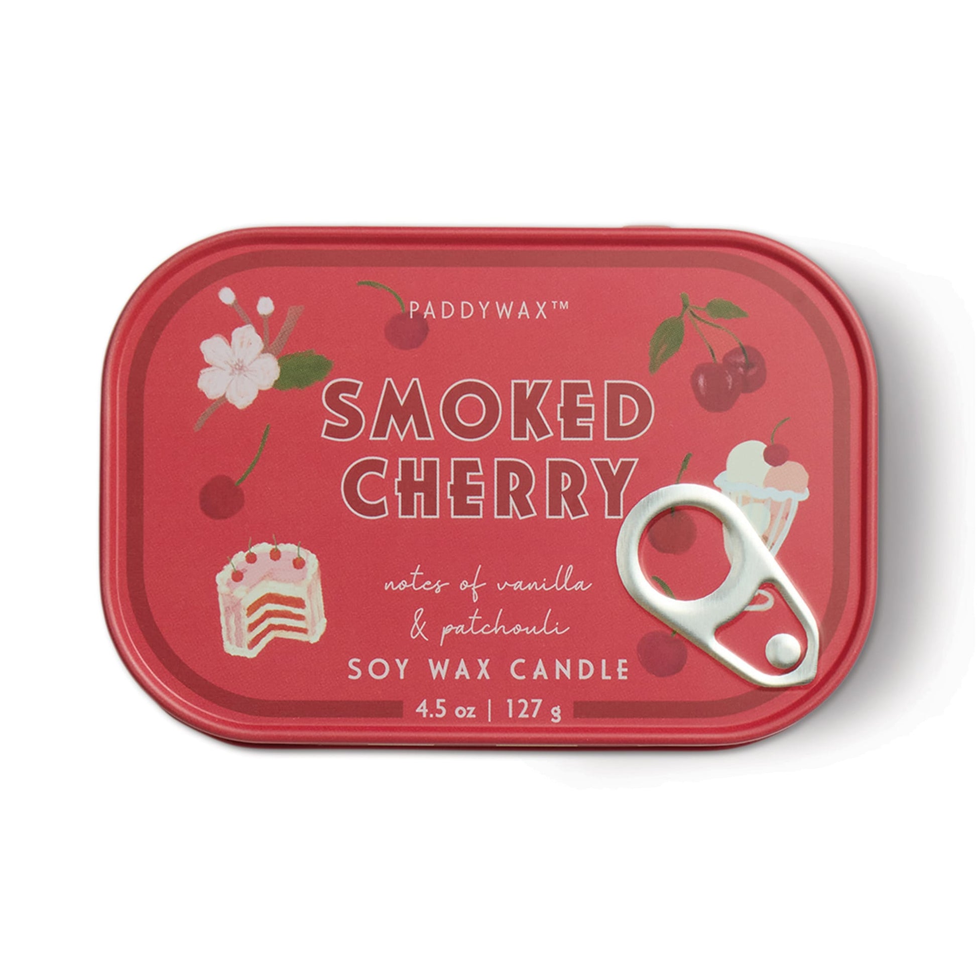 Red tin container labeled "Smoked Cherry - Bistro Tin 4.5 oz Candle" with cherry, cake, and flower illustrations. Features notes of vanilla & patchouli; soy wax candle, 127 g, with pull-tab lid.