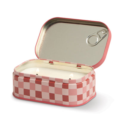 The Smoked Cherry - Bistro Tin 4.5 oz Candle features a pink and white checkered sardine-style tin with a pull-back lid, holding a white candle with two wicks inside.
