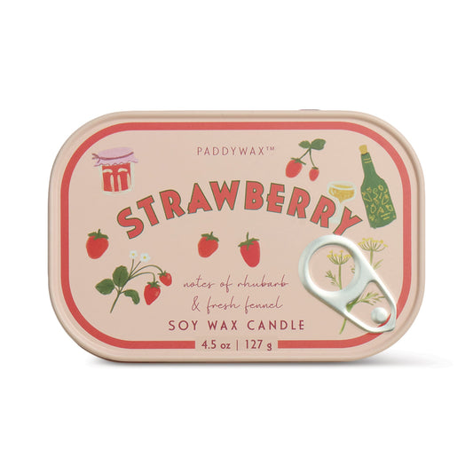 A pink Bistro Tin 4.5 oz Candle labeled "Strawberry," features strawberry, flower, and champagne illustrations; the front notes rhubarb and fresh fennel.