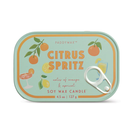 The Citrus Spritz - Bistro Tin 4.5 oz Candle features a rectangular tin with illustrations of oranges, a lemon, and citrus drinks on a mint-green background with orange and yellow accents.