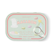 The Macaron - Bistro 4.5 oz Tin Candle comes in a pastel green tin adorned with playful illustrations of macarons, teacups, and a flower vase. French-inspired, it enchants with a Macaron fragrance combining vanilla bean and pink pistachio. This charming candle is finished with a convenient pull-tab lid.