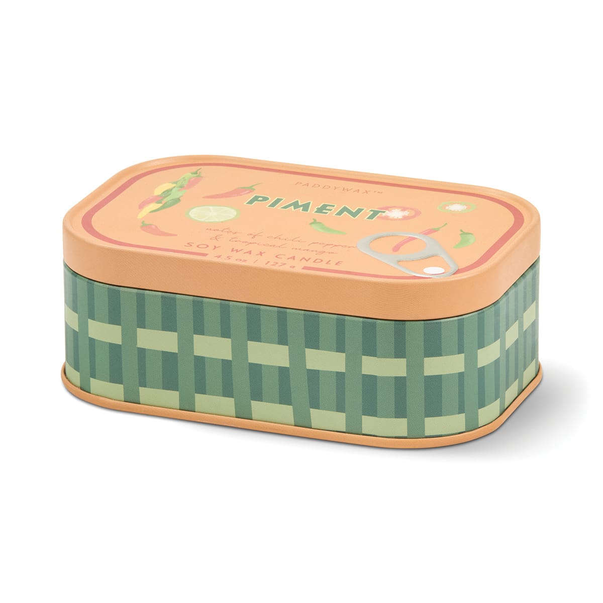 The Piment - Bistro 4.5 oz Tin Candle is a rectangular soy wax candle housed in a tin can decorated with a green plaid design and topped with a peach-colored lid labeled “Piment.” The lid showcases illustrations of peppers, garlic, and scissors, evoking the look of a classic sardine can. Inside, the candle delivers the warm and inviting Piment fragrance with notes of fruit and spice.