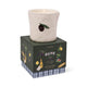 The Fig & Olive - Bistro Candle 8 oz, a white ceramic candle holder with an olive design, rests on its box decorated with olives, olive oil, bread, and lemons—perfect for bistro or hand-painted ceramic candles.