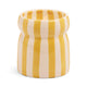 The Cabana Ceramic Candle - Gold Coast features vertical yellow and white stripes with a gently indented middle, capturing the relaxed coastal charm of its namesake.