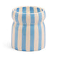 The Cabana Blue Candle - Lost At Sea features vertical blue and white stripes with a slightly flared rim, inspired by our Cabana collection—ideal for adding relaxed coastal charm to your space.