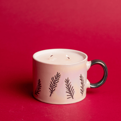 Lit Cypress & Fir - 8oz White Ceramic Mug candle on a red background