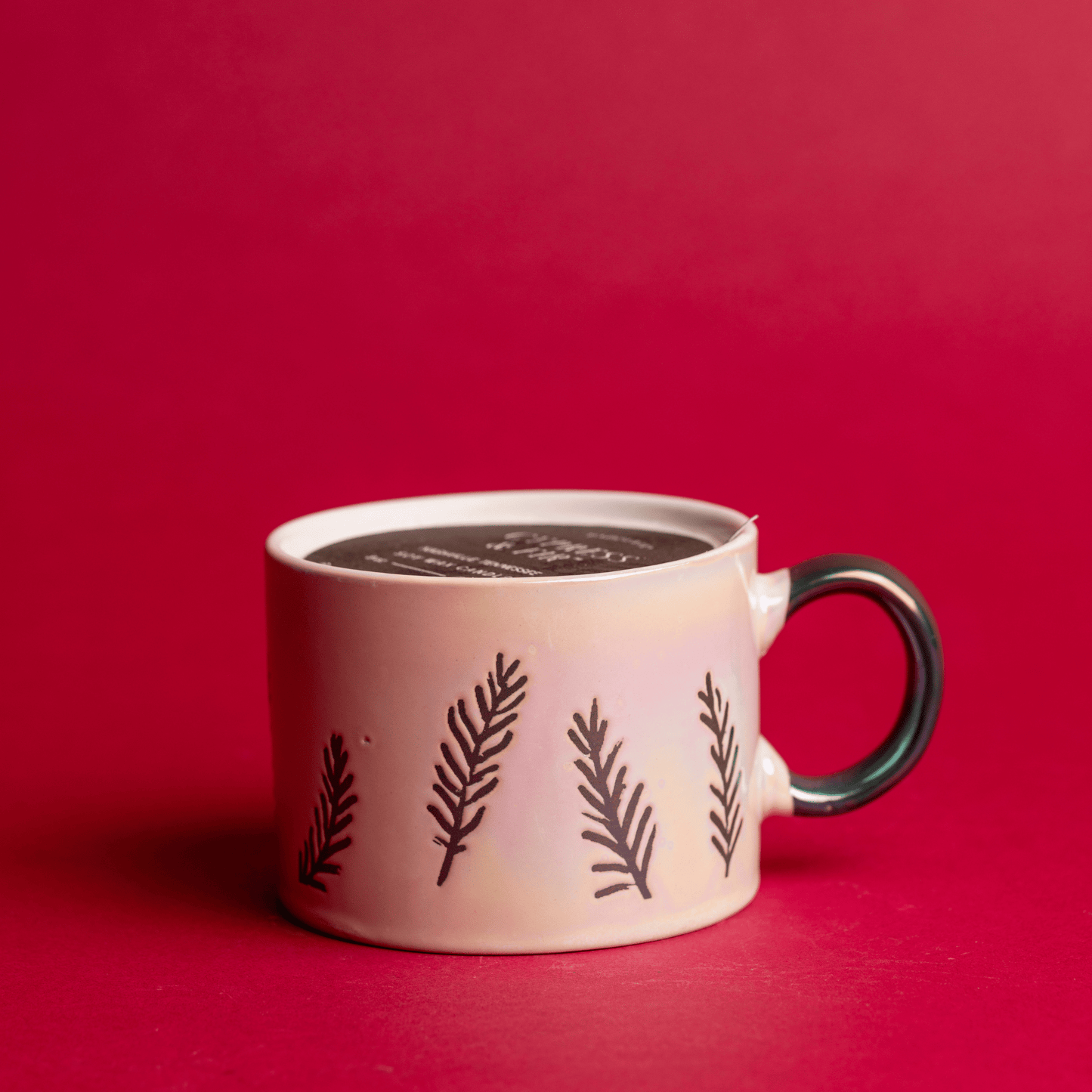 Cypress & Fir - 8oz White Ceramic Mug candle on a red background