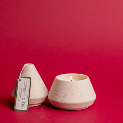 Small White Tree Stack unstacked with candle lit resting on red table