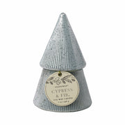 The Cypress + Fir Silver Tree - 7 oz Candle is a light blue, tree-shaped soy wax candle with textured detail and pine illustrations. Its front round tag reads "Cypress & Fir, soy wax candle, 7 oz / 198 g." Perfect for holiday-scented candle lovers.