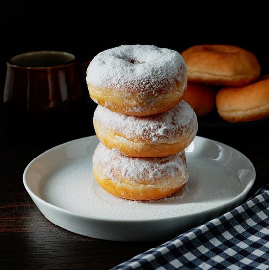 Donuts with powdered sugar on top