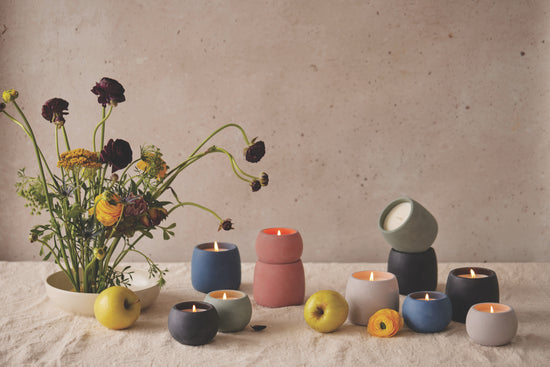 Elements Collection of candles on a beige table cloth