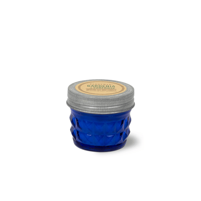 Small blue glass Gardenia & Tuberose - Relish 3 oz Candle jar with a metal lid, perfect for upcycling as a storage jar.