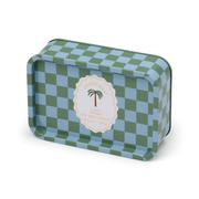 A rectangular tin candle with a blue and green checkerboard pattern and a central label reading “Lush Palms - A Dopo 6.5 oz Tin Candle”—ideal for anyone who loves Mediterranean-inspired candles.
