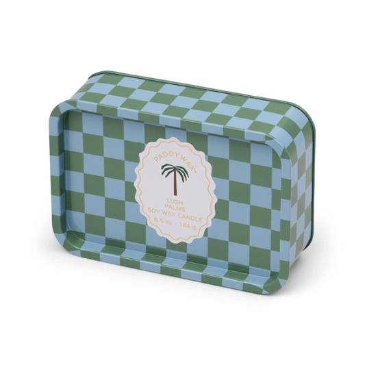 A rectangular tin candle with a blue and green checkerboard pattern and a central label reading “Lush Palms - A Dopo 6.5 oz Tin Candle”—ideal for anyone who loves Mediterranean-inspired candles.