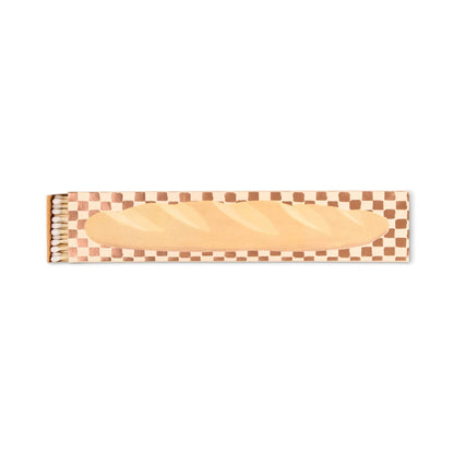 The Baguette - Extra Long Boxed Matches feature a French baguette illustration and a brown and white checkered border. The open box reveals safety matches—an ideal charming Parisian-inspired gift.