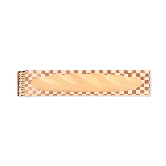 The Baguette - Extra Long Boxed Matches feature a French baguette illustration and a brown and white checkered border. The open box reveals safety matches—an ideal charming Parisian-inspired gift.