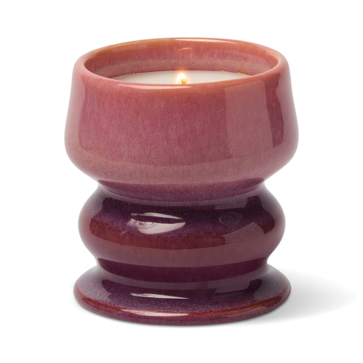 A lit Wild Fig & Cedar - Melt 8.5 oz Candle in a glossy, purple-pink ceramic holder with a rounded, hourglass shape, shown against a white background.
