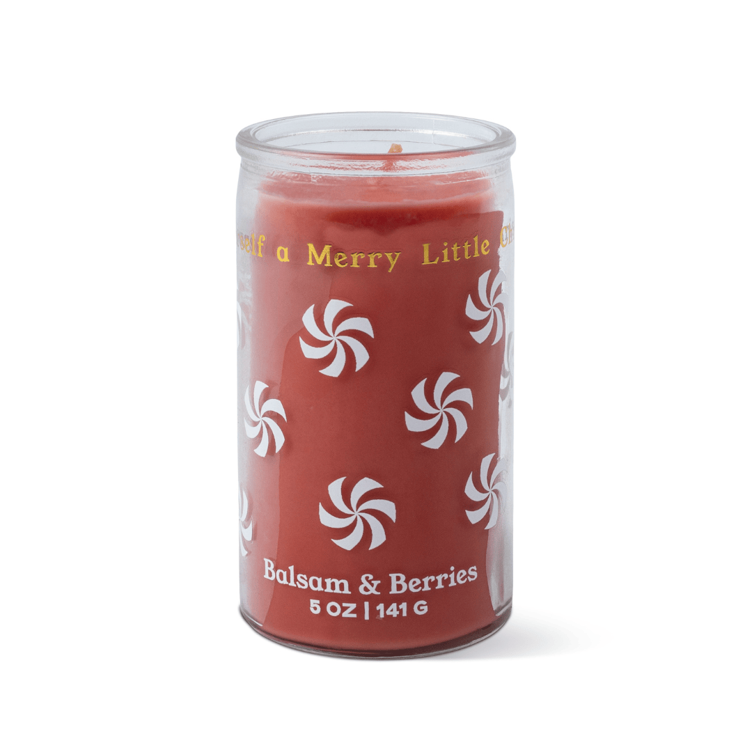 A Balsam & Berries - 5 oz Candle, featuring a red wax in a clear glass jar decorated with white peppermint swirl designs.
