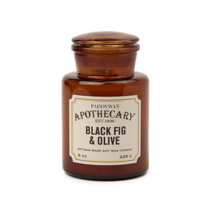 Paddywax Apothecary Black Fig & Olive candle in an amber jar on a white background