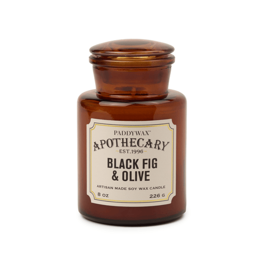 Paddywax Apothecary Black Fig & Olive candle in an amber jar on a white background
