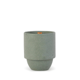 The Great Smoky Mountains - Parks 11 oz Candle features a green cylindrical ceramic vessel with a matte finish, tapered base, and small wooden tag on the rim, echoing national park vibes against a white background.