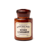 The Vetiver + Cardamom - Apothecary 8 oz Candle is an artisan soy wax candle in a brown amber glass jar, inspired by vintage apothecary bottles.