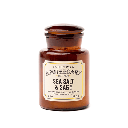 Brown apothecary-style candle labeled 'Sea Salt & Sage' by Paddywax on a white background