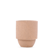 A plain, cylindrical beige ceramic cup with a smooth surface and gently flared rim, set against a white background—ideal for holding the Yellowstone - Parks 11 oz Candle featuring a crackling wood wick.