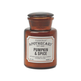 An 8 oz artisan soy wax candle labeled Pumpkin + Spice - Apothecary comes in a brown amber glass jar and features a fall-inspired scent by Paddywax.