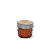 Pumpkin + Spice - Relish 3 oz Candle in an amber-colored glass jar with a textured geometric pattern and a rustic metal lid.