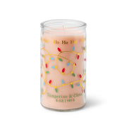 A 5 oz Tangerine & Clove candle in a glass jar, featuring a pink wax, colorful holiday lights, and the phrase “Ho Ho Ho!” on the label.