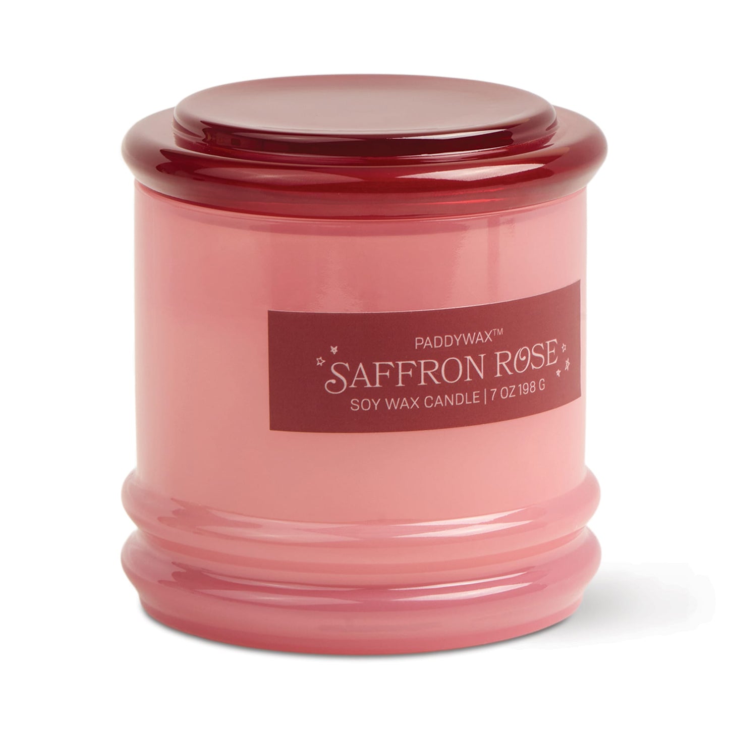 The Saffron Rose - Stack 7 oz Candle features a pink glass jar with matching lid, dark pink label with white text and small stars, and a reusable container that adds charm to this rose-scented soy wax candle.