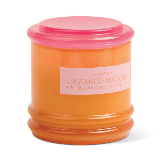 An orange glass vessel with a pink lid labeled "Infrared Mango - Stack 7 oz Candle"—ideal for reuse as storage after enjoying its fragrance.
