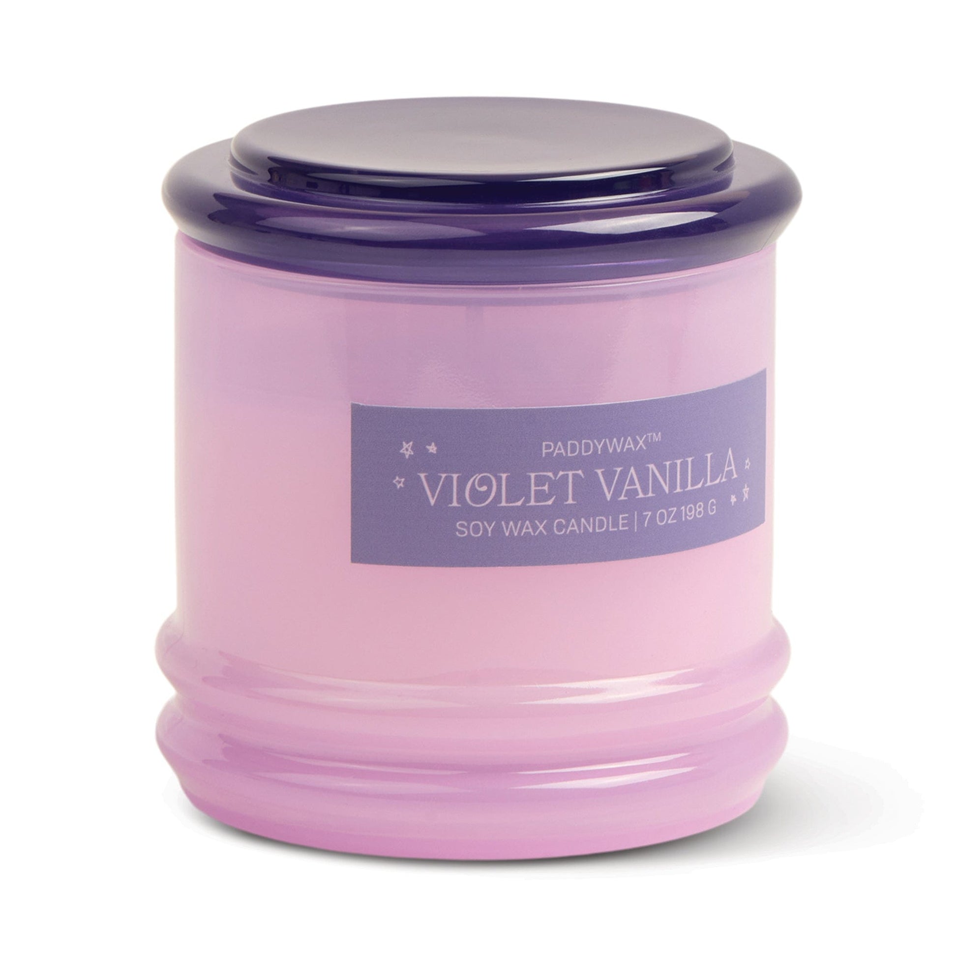 A lavender glass vessel with a dark purple lid, labeled Violet Vanilla - Stack 7 oz Candle, offers a floral scent and reusable style to add elegance to any room.
