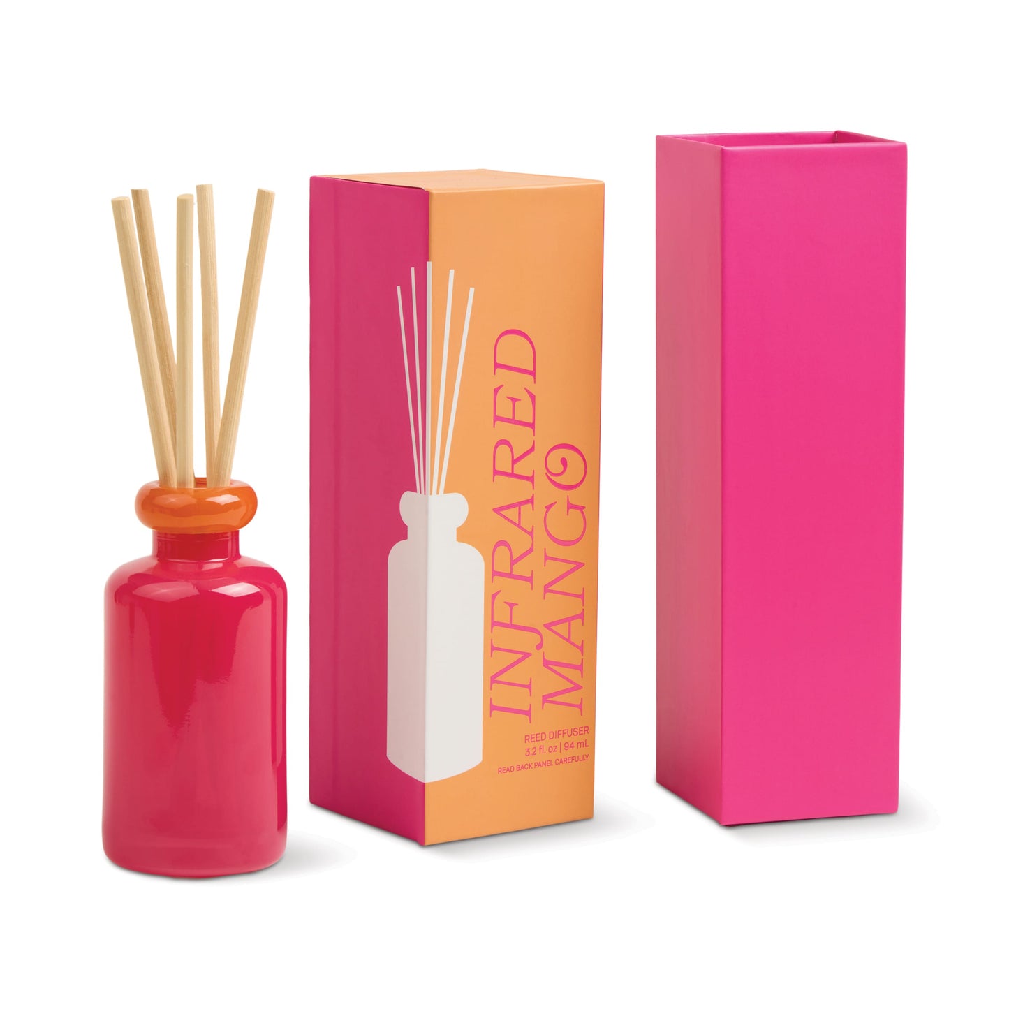 The Infrared Mango - Stack 3.2 oz Diffuser features a pink bottle with wooden reeds beside two boxes—one orange and pink labeled "Infrared Mango," the other solid pink—adding a burst of tropical fragrance to your space.
