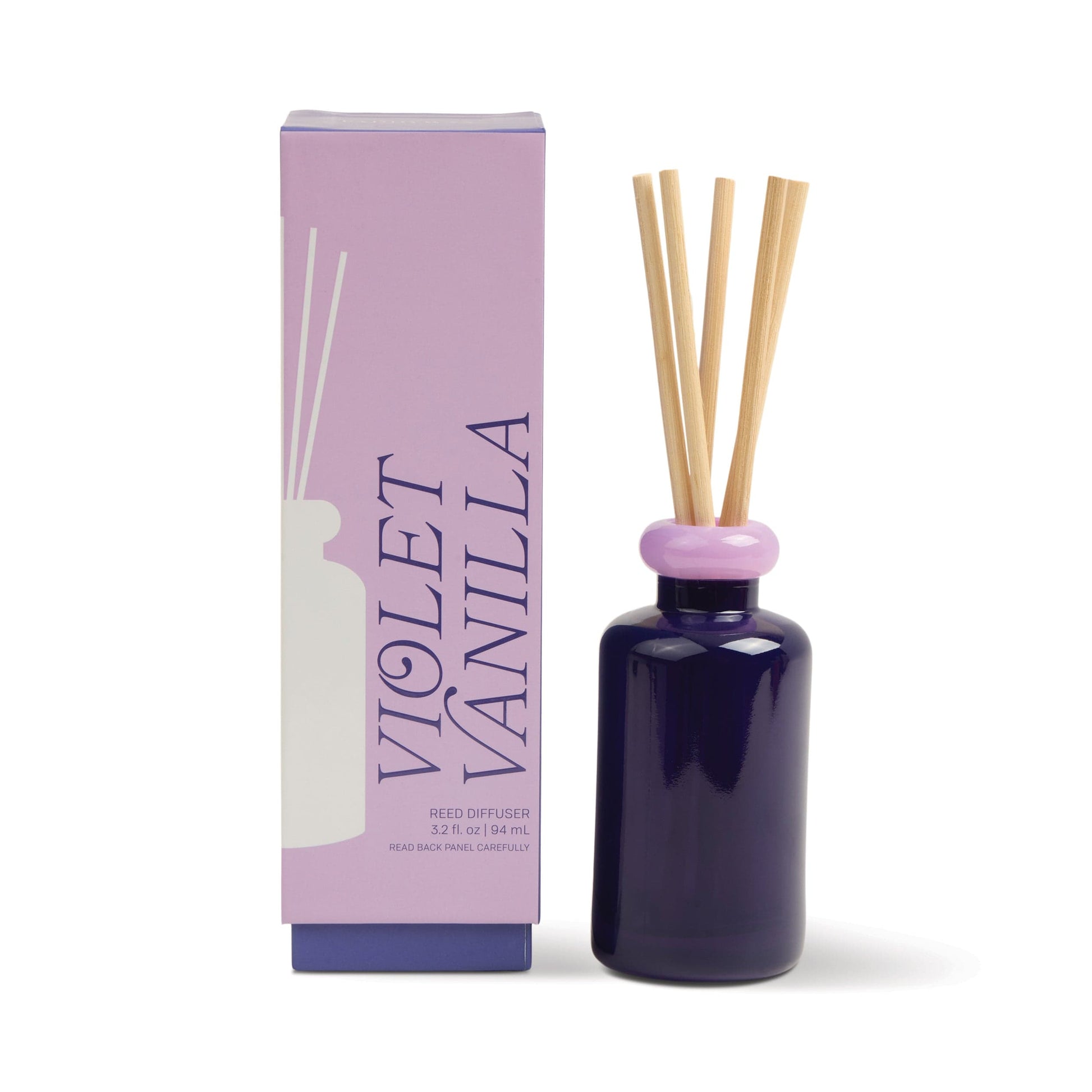 The Violet Vanilla - Stack 3.2 oz Diffuser features a violet bottle with a lavender collar and wooden sticks, shown beside a matching box—perfect to pair with the Violet Vanilla candle for a full floral scent experience.