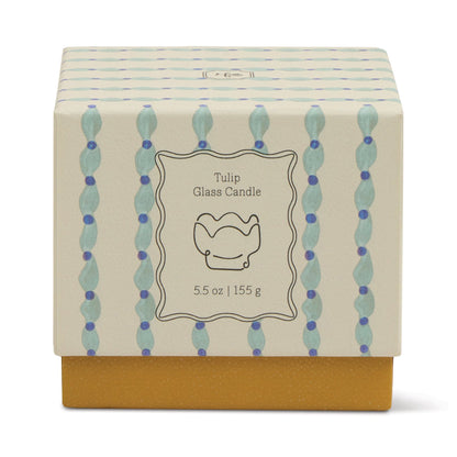 A decorative box with blue and purple dotted vertical lines and a yellow base, labeled Wisteria & Willow - Tulip 5.5 oz Candle, features a simple tulip illustration—ideal for gifting or displaying your favorite botanical scent.