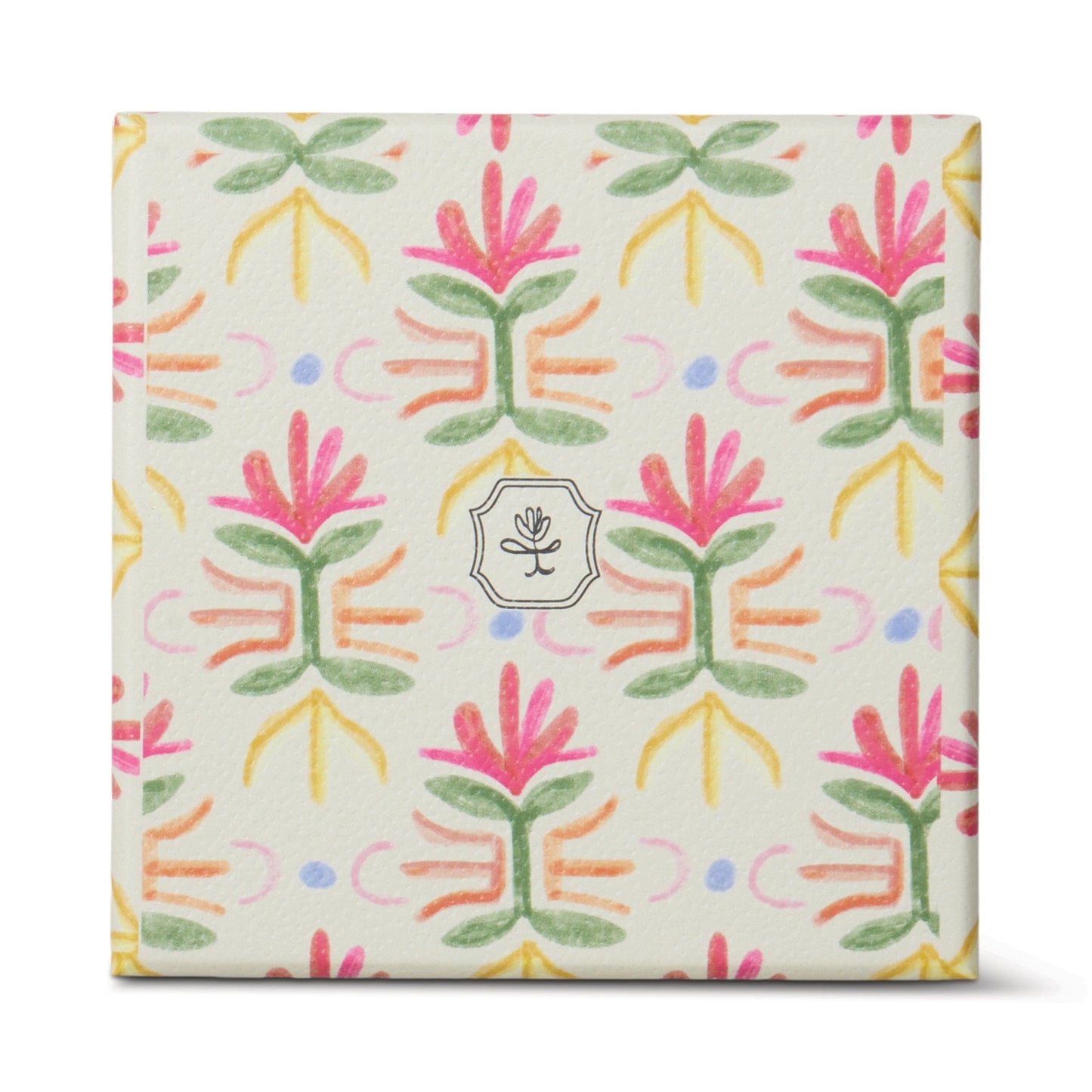 The Bronzed Gardenia - Tulip 5.5 oz Candle comes in a square box with a colorful floral pattern in pink, green, yellow, and purple on white, featuring a small circular flower logo—perfect for adding floral charm to your home décor.
