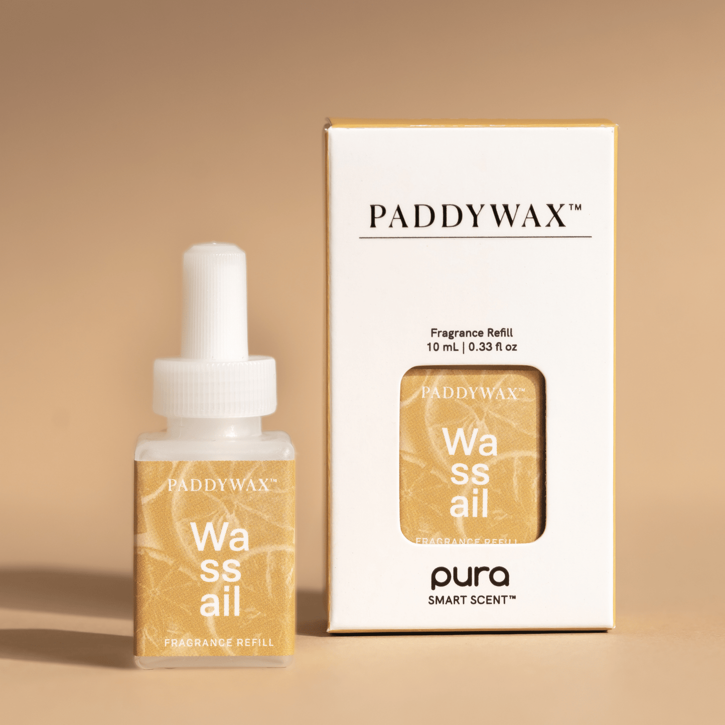 Paddywax fragrance Pura refill Wassail sitting on pale surface