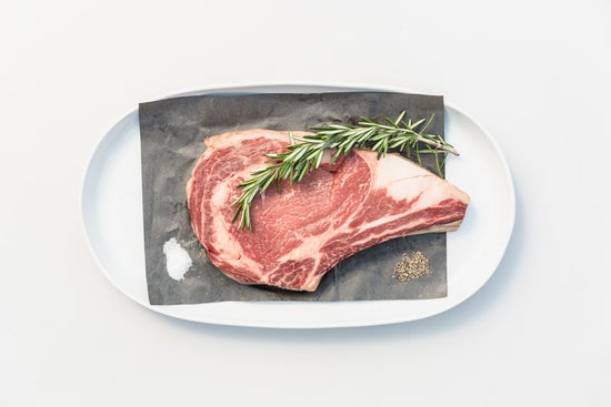 Bone in steak on platter