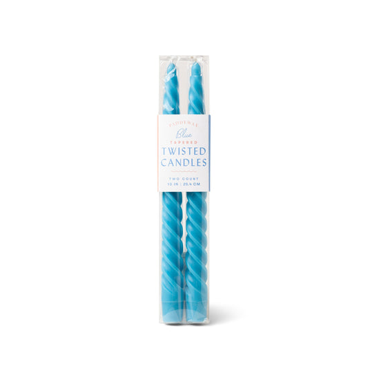 two bright blue taper candles with twist design; pictured inside clear packaging with white label