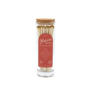 5.25" gold-tipped matches in tall glass tube with cork stopper; red label on the side reads “Fireside Matches”; 85 matches inside