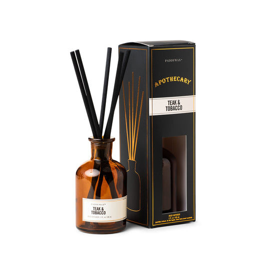 3 oz brown glass apothecary bottle filled with diffuser sticks; pictured next to the black packaging