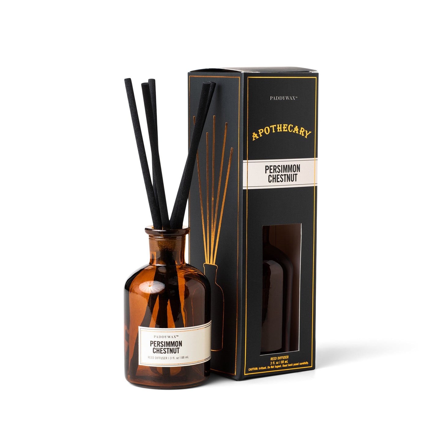 3 oz brown glass apothecary bottle filled with diffuser sticks; pictured next to the black packaging