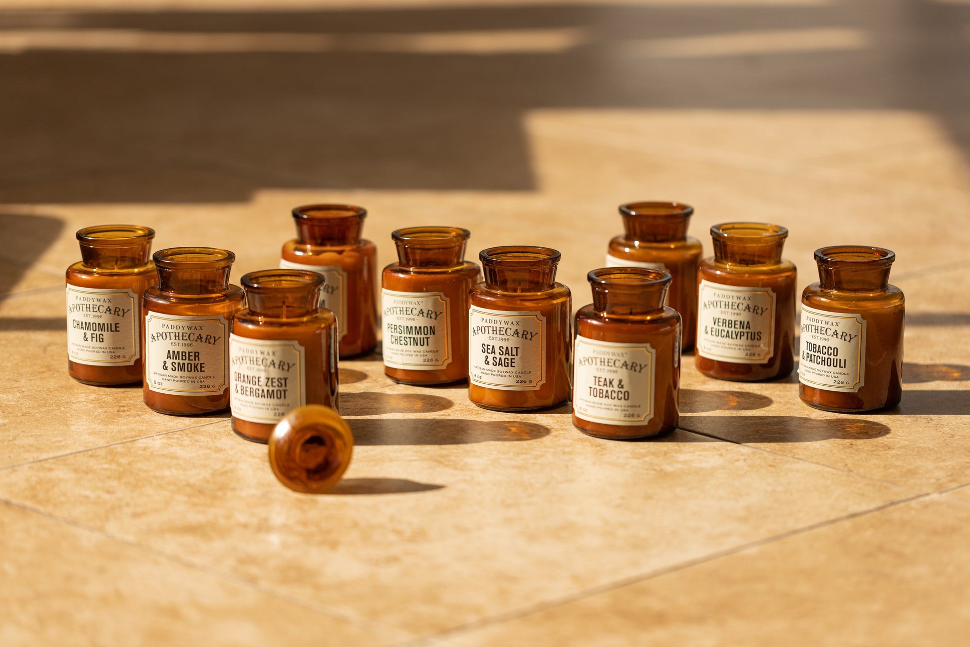 Collection shot of Apothecary Collection with 3 rows of brown amber candle jars