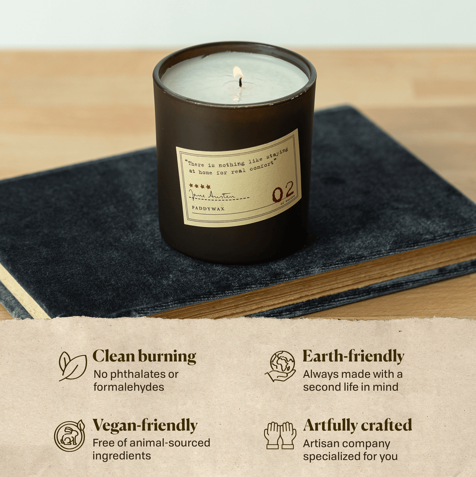 A photo of the Jane Austen candle sitting on a book. Clean burning: no phthalates or formaldehydes. Earth-friendly: Always made with a second life in mind. Vegan-friendly: Free of animal sourced ingredients. Artfully crafted: Artisan company specialized for you.