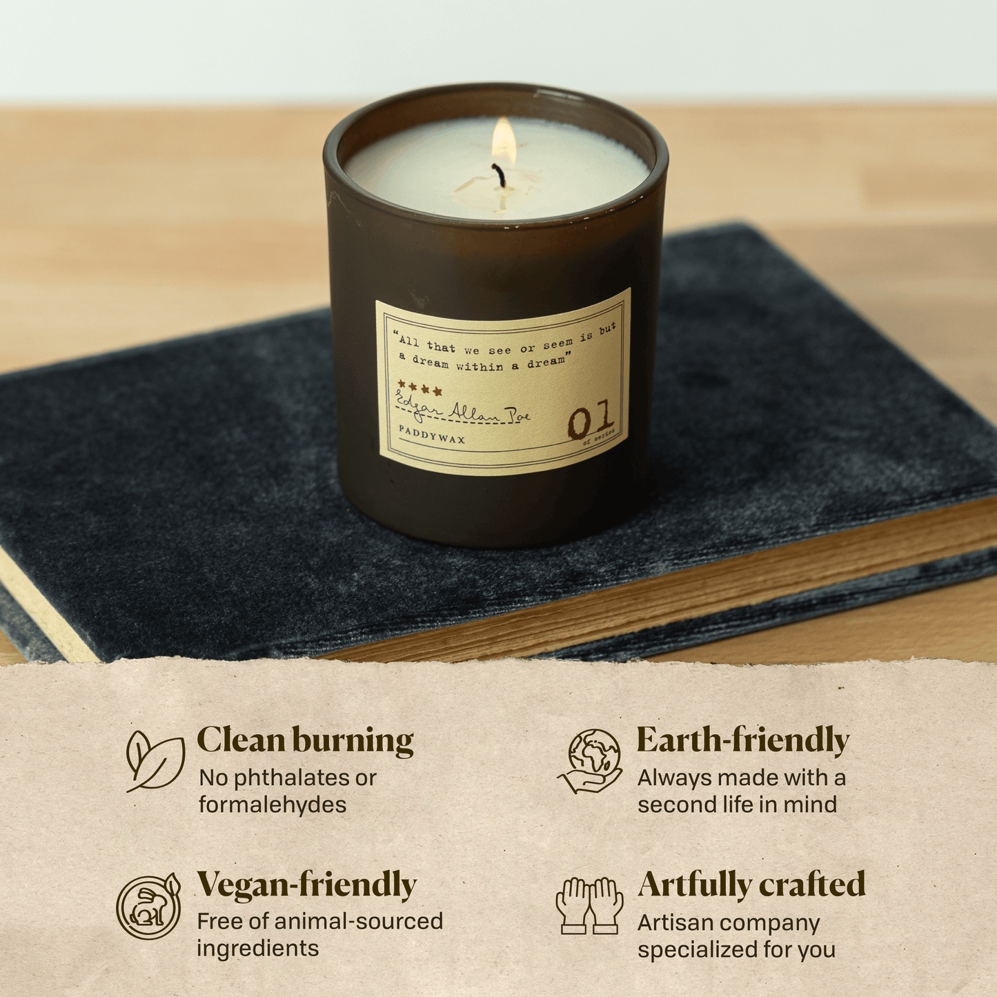 A photo of the Edgar Allan Poe candle sitting on a book. Clean burning: no phthalates or formaldehydes. Earth-friendly: Always made with a second life in mind. Vegan-friendly: Free of animal sourced ingredients. Artfully crafted: Artisan company specialized for you.