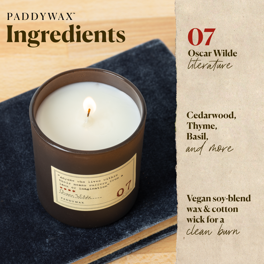 Photo of the Oscar Wilde Library candle with a list of ingredients. Cedarwood, thyme, basil, and more. Vegan soy blend wax and cotton wick for a clean burn.