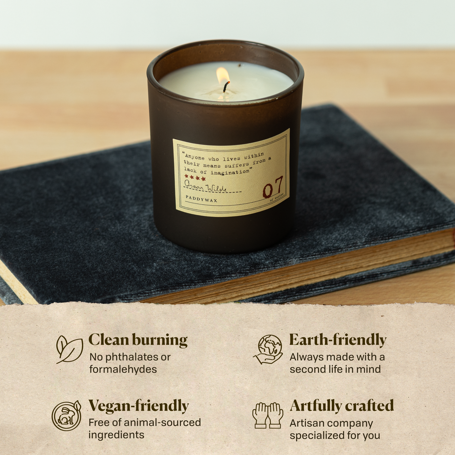 A photo of the Oscar Wilde candle sitting on a book. Clean burning: no phthalates or formaldehydes. Earth-friendly: Always made with a second life in mind. Vegan-friendly: Free of animal sourced ingredients. Artfully crafted: Artisan company specialized for you.