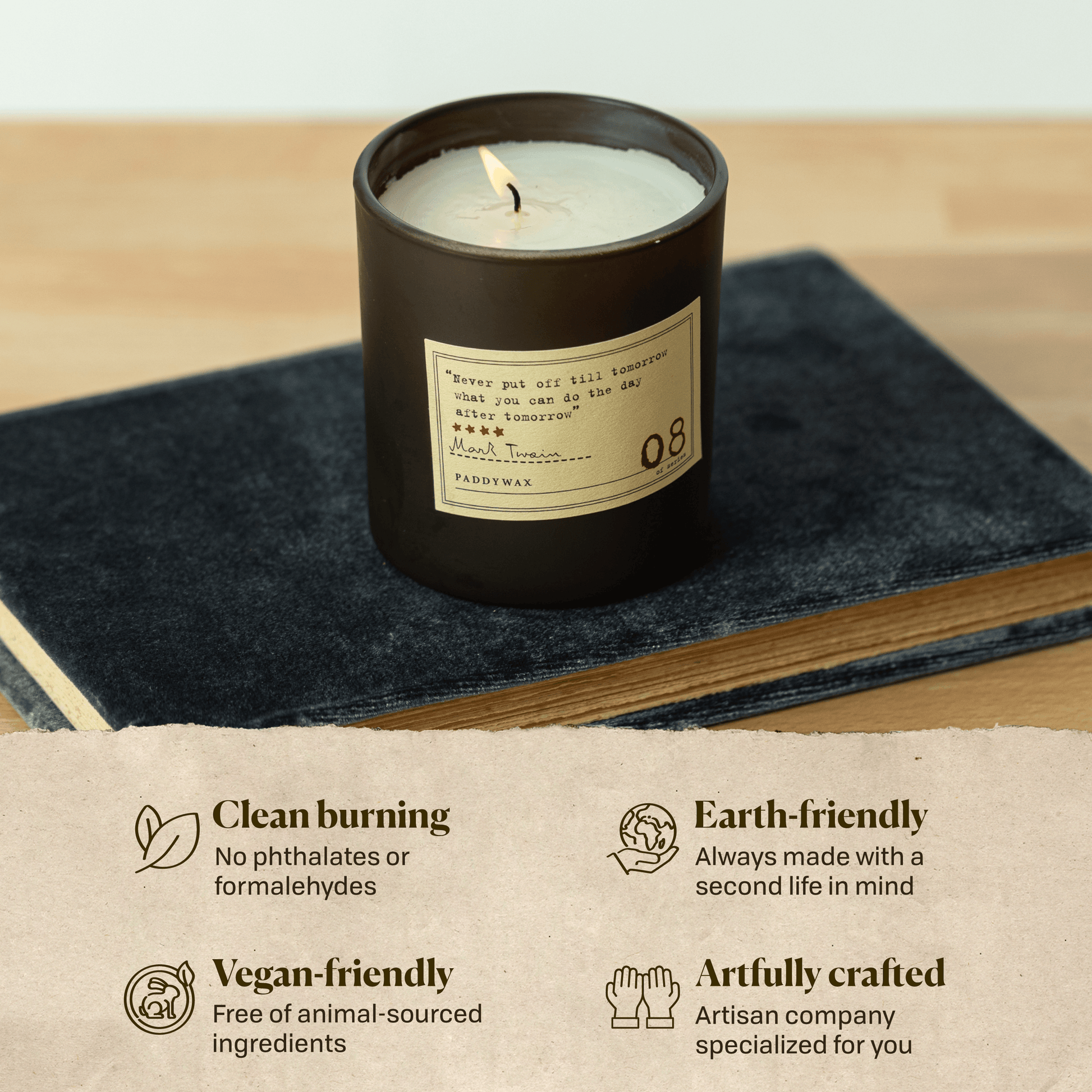A photo of the Mark Twain candle sitting on a book. Clean burning: no phthalates or formaldehydes. Earth-friendly: Always made with a second life in mind. Vegan-friendly: Free of animal sourced ingredients. Artfully crafted: Artisan company specialized for you. 